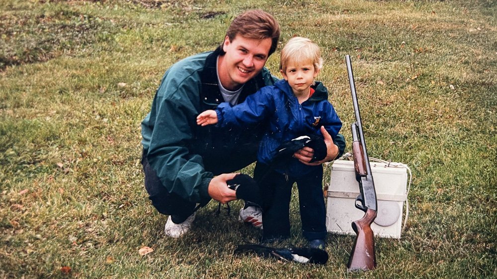 Sheldon and his son Dakota on his farm with one of his homemade predator callers